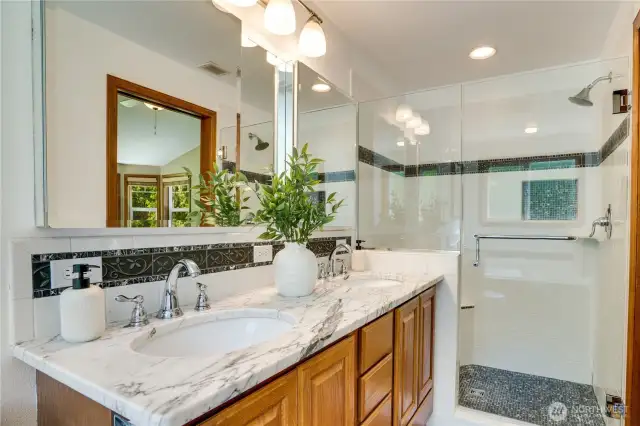 Lavish primary en-suite with heated floors and spa-like elegance.