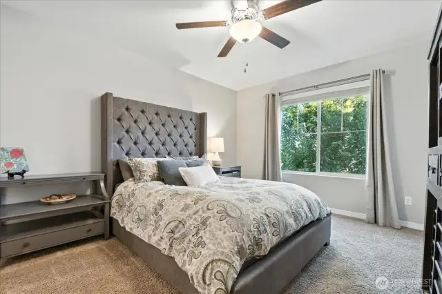 Primary Bedroom, w/ ceiling fan, balcony, walk-in closet & ensuite primary bath