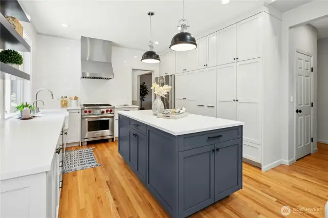 The kitchen has a great prep island and ample pantry storage. Plus a wonderful built-in coffee bar.