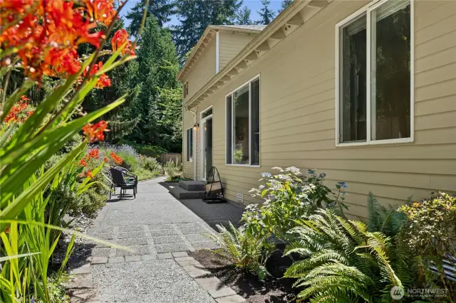 The breakfast nook spills out to the spacious backyard. The large fenced backyard has multiple spaces for gardening, playing and relaxing.