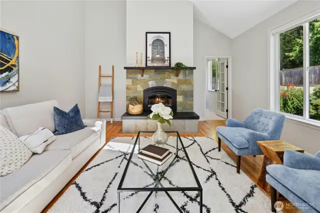 Back inside to the family room with tall vaulted ceilings. The entire home was just freshly painted.