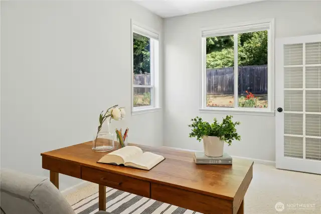 Behind the family room is another home office or guest room. This space offers a little more privacy and great light and views out to the back garden.