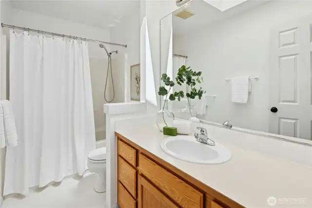 The main hallway bathroom upstairs with a tub and shower combo.