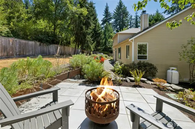 The upper patio area on the lot has a nice sunny outlook over the yard.