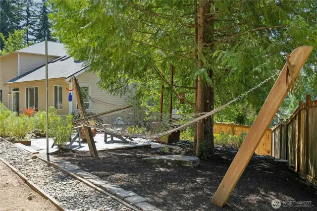 There are multiple spaces on the large lot for relaxation and hobbies.