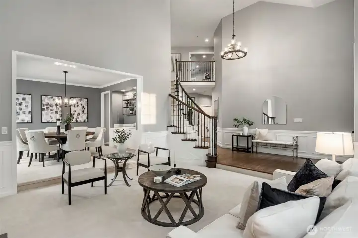 Open-concept floor plan - timeless elegance, featuring rich, freshly refinished hardwood floors.