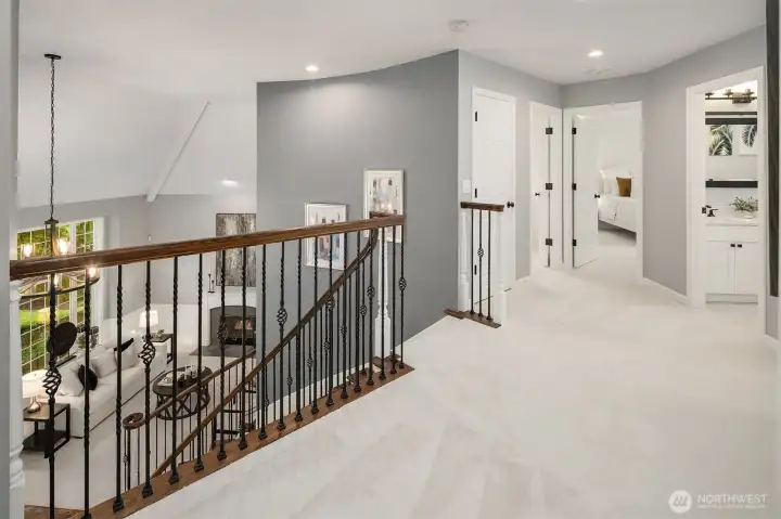 The upstairs landing opens to four spacious bedrooms, two full baths, and a versatile bonus room - offering plenty of space for rest, work, and play.