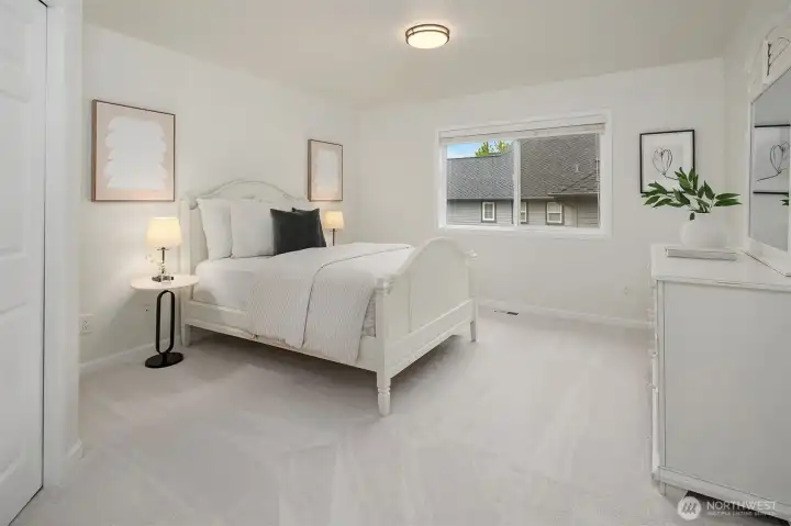 Upper level bedroom #2. All the bedroom closets feature custom closet systems for easy organization.