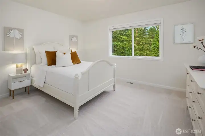 Upper level bedroom #3. All the bedroom closets feature custom closet systems for easy organization.