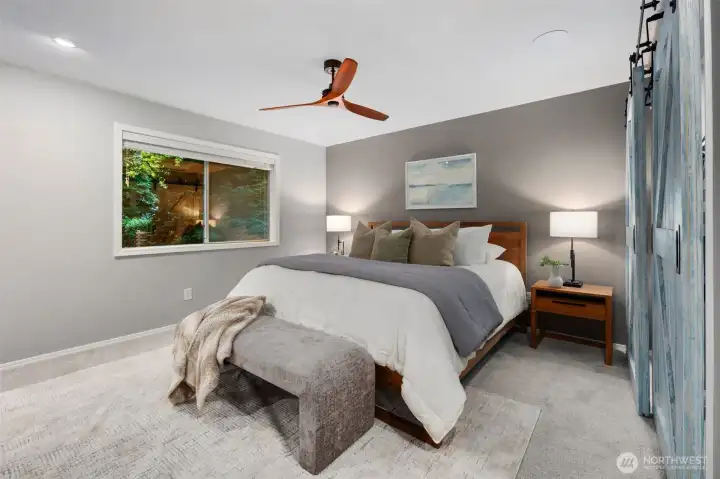 Primary Bedroom with updated windows, carpet, paint, and custom closet to the right