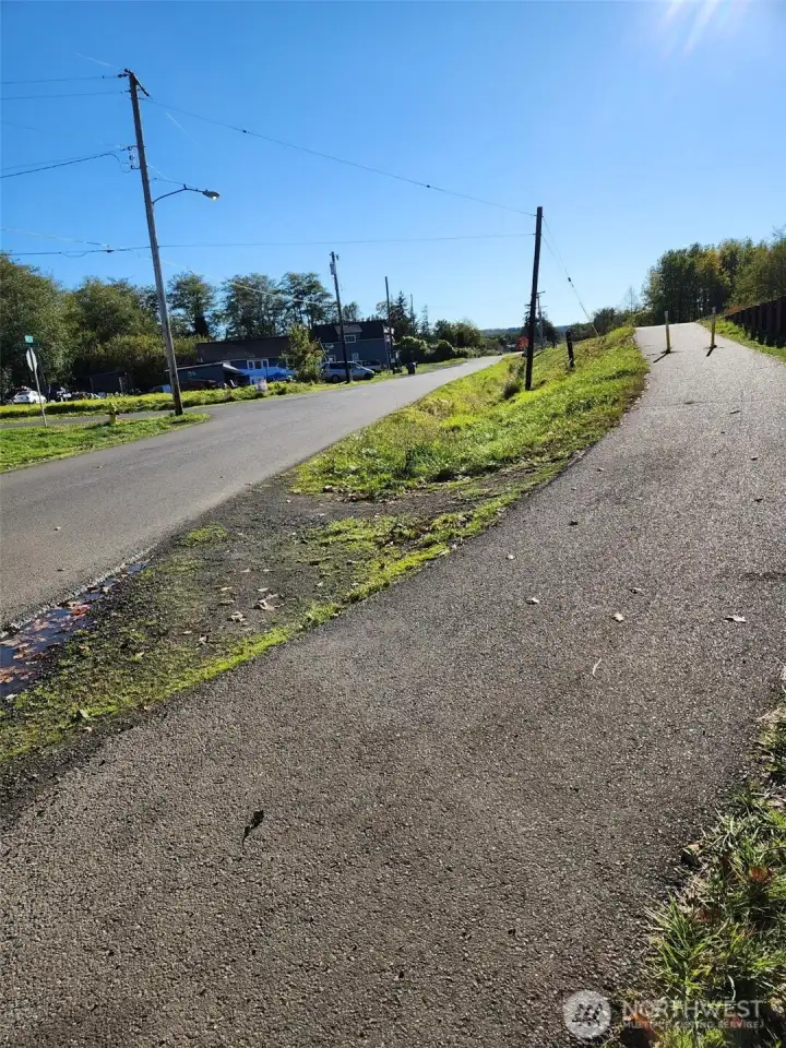 The walking/biking trail is right across the street from this lot.