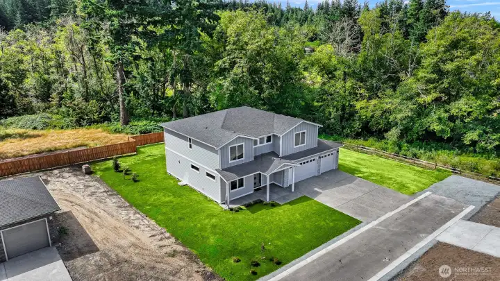 Grass has been virtually added to photo. Sod has now been installed.