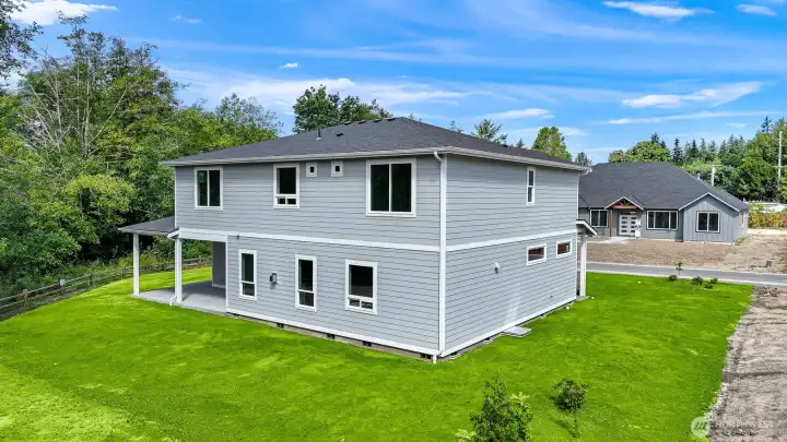 Grass has been virtually added to photo. Sod has now been installed.