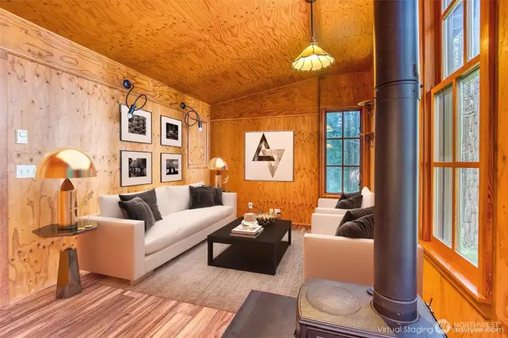 Living room with wood burning stove and views of the sound.
