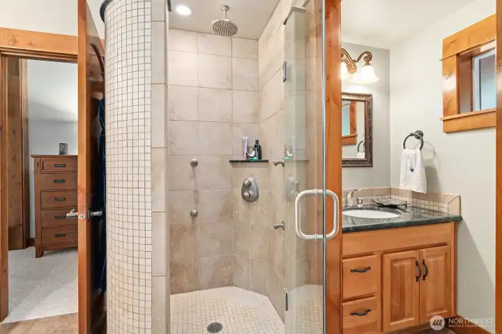 Enjoy the full tile walk in shower with multi shower heads and 3rd sink