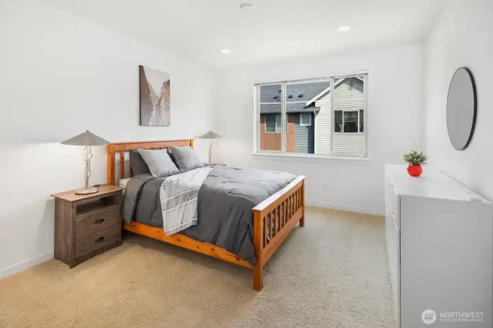 Primary bedroom suite is large enough for any size bed and furniture set.