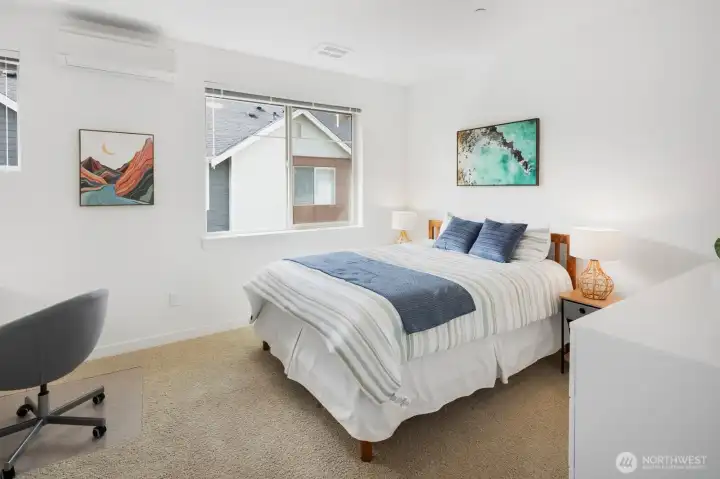 Second bedroom has two windows and room for multiple uses.