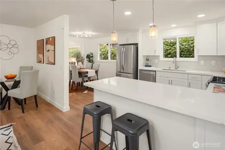 Just off the kitchen and dining room is a fantastic family room that allows for a second lounge area and even a casual dining spot.