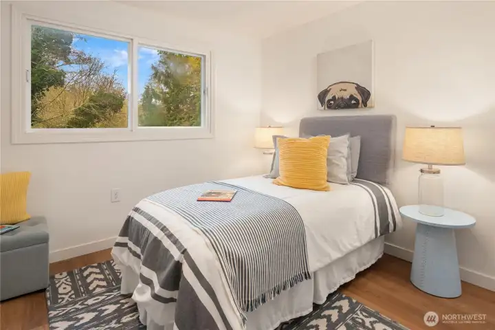 The third bedroom is in addition to the fourth bedroom in the ADU over the garage.