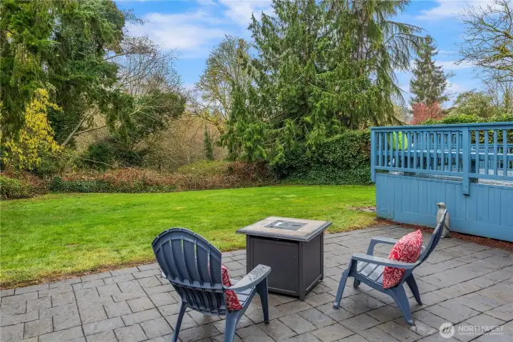 Just off the deck is this paver patio complete with a fire pit.