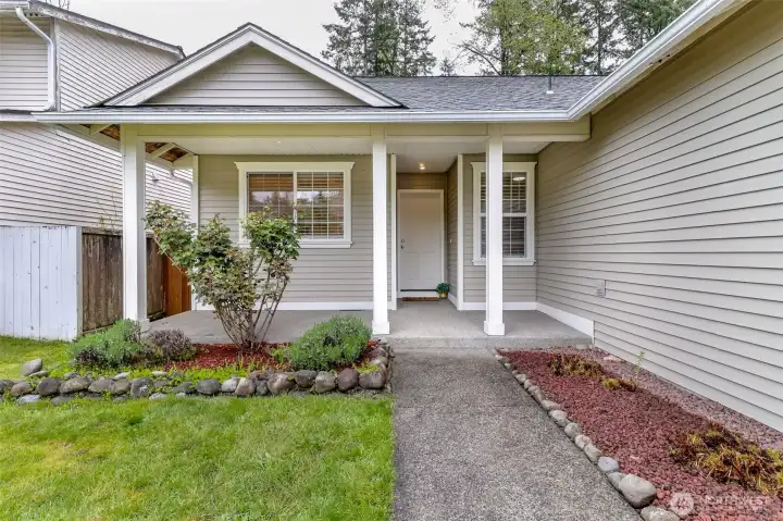 Cute covered front porch.