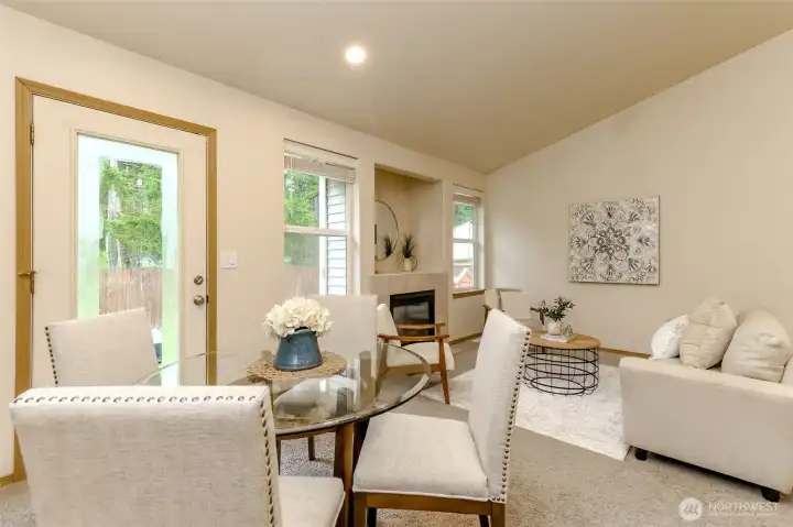Dining room with an access door to the back patio.