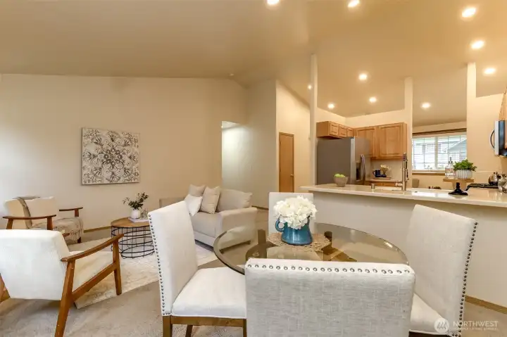 Dining room open to kitchen and family room faces the front door and entry.
