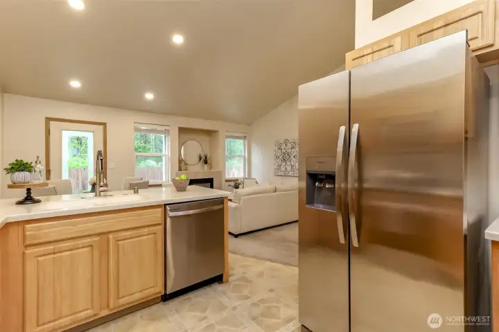 New fridge with water and ice in the door.