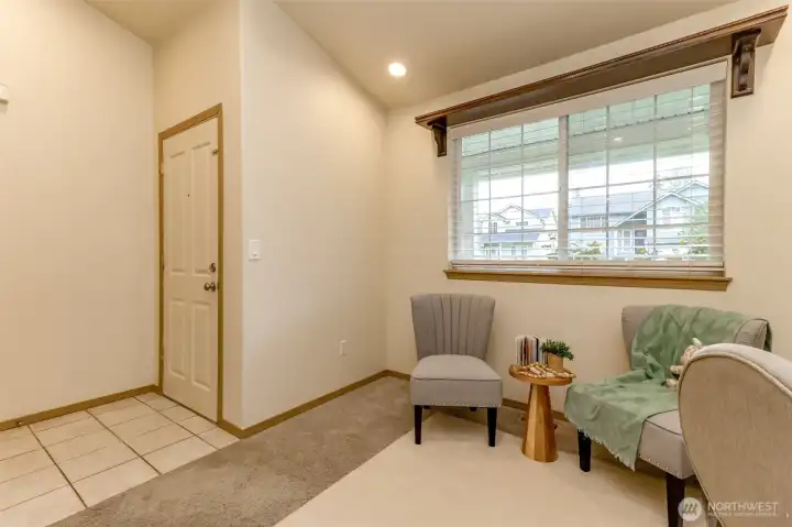 Front door and room off the entry. This window looks out over the covered front porch and front yard.