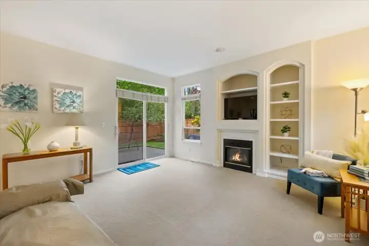 Family room with tall ceiling and backyard access
