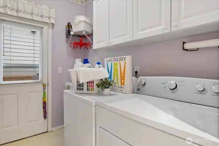 Laundry room with access door to back yard