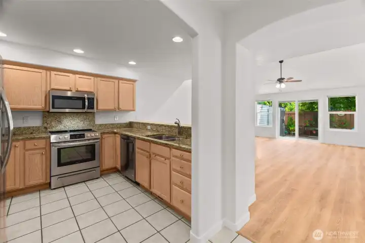The airy and open floorplan is easily viewed at this angle, seen from the hallway that comes from the front entrance. The airy and open floorplan is easily viewed at this angle, seen from the hallway that comes from the front entrance.