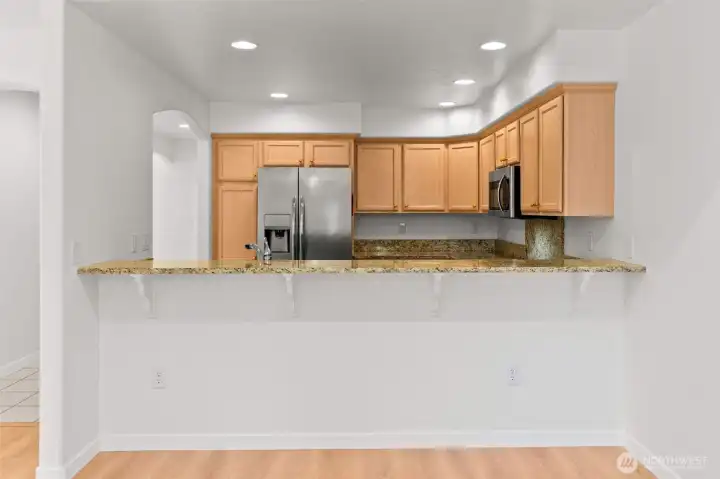 The eat-in bar is a fabulous way to connect the space and allow for easy meals or simply great conversation while utilizing the wonderful kitchen. The eat-in bar is a fabulous way to connect the space and allow for easy meals or simply great conversation while utilizing the wonderful kitchen.