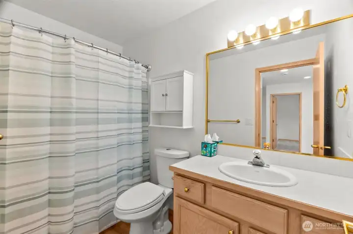 Hall bath upstairs provides a shower/tub combo to meet the needs of family or guests. Hall bath upstairs provides a shower/tub combo to meet the needs of family or guests.