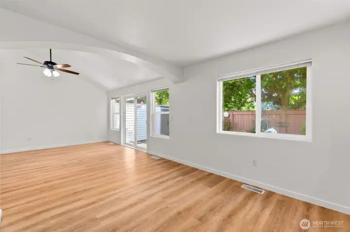 Once again in the main living area, the many windows along this wall allow you to take in the beauty of the outdoor space. Once again in the main living area, the many windows along this wall allow you to take in the beauty of the outdoor space.