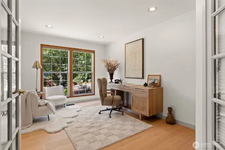 Office off entry way with oversized windows