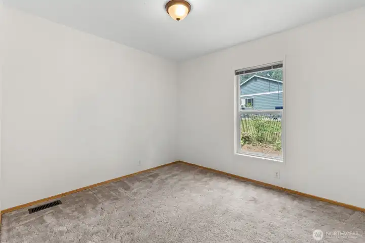 Bedroom 3. Furniture removed digitally.