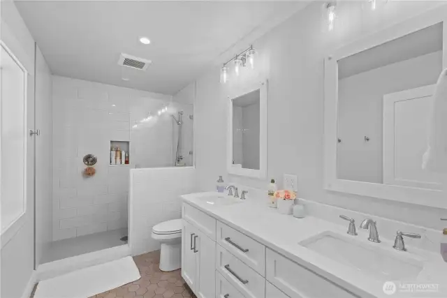 Beautiful custom tiled primary shower/bath.