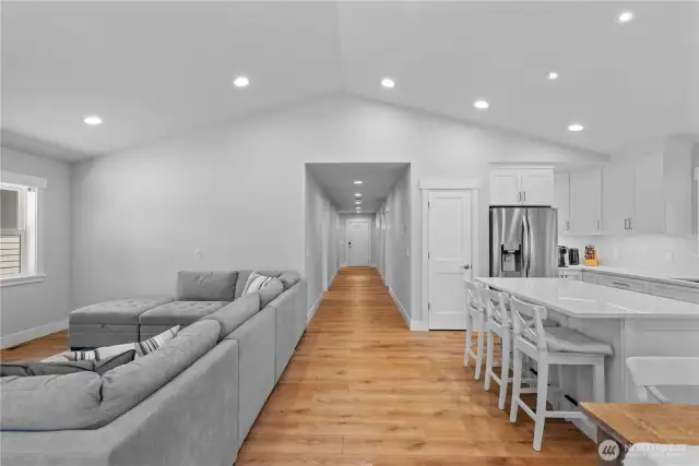 Looking from rear covered porch entry to front entry/hallway
