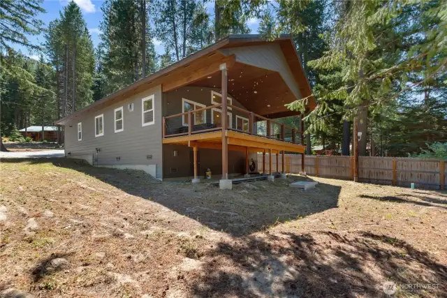 Expansive covered rear deck for outdoor enjoyment.