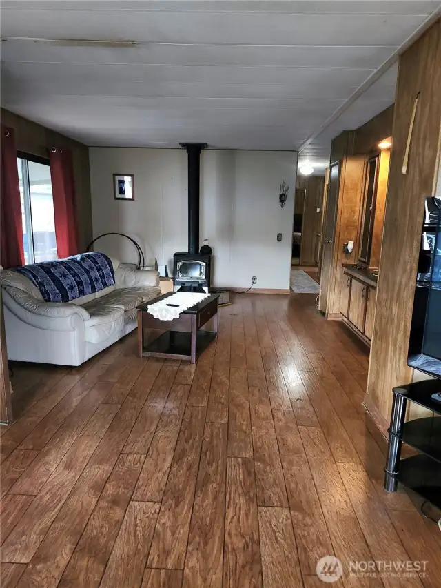 Family room with wood stove, wet bar and slider to big, covered deck