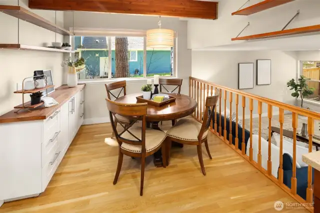 The breakfast nook overlooks the family room. More great built-in cabinets and open shelving complete the eating area.