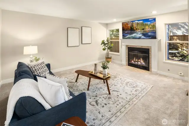 The cozy family room with a gas fireplace.