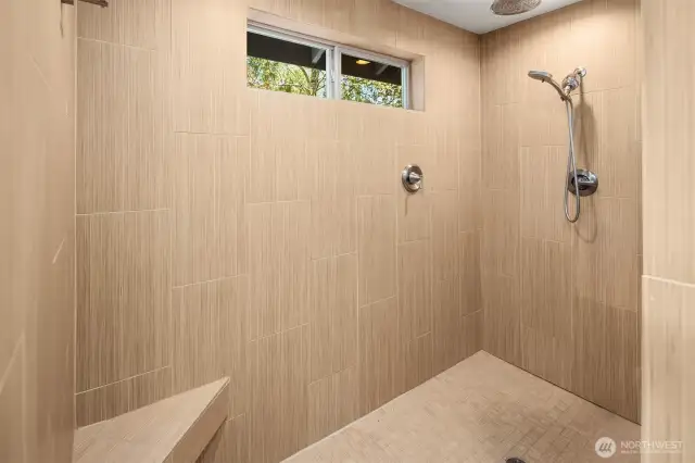 Oversized shower with two showerheads.