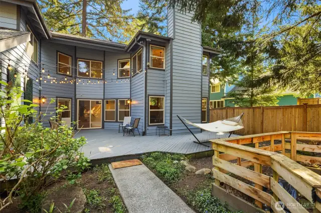 Enchanting backyard with plenty of deck space and string lights.
