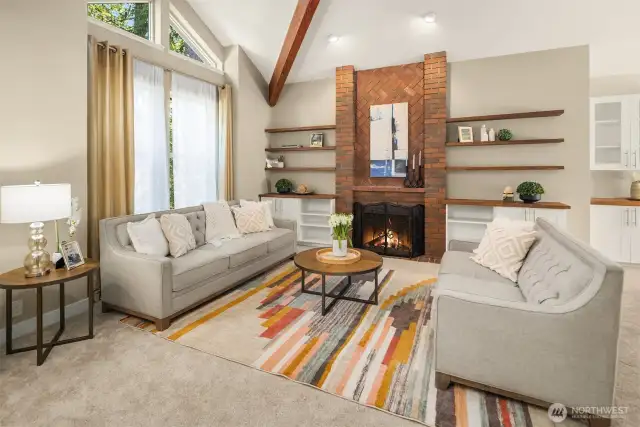 The first of four fireplaces in the house. Note all of the built-in cabinets for storage and open shelving for displaying your art, books, and pottery.