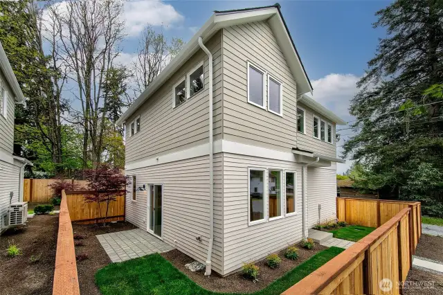 Fully fenced yard with patio
