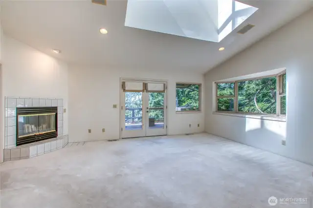 Primary bedroom with fireplace & forever views