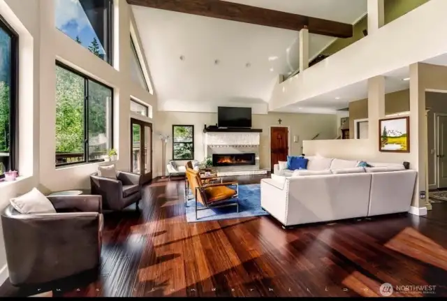 A luxurious great room soars 2 stories high, featuring rich hardwoods and timeless finishes.