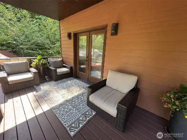 Main floor bedrooms have direct access to covered decks ~ perfect way to start or end your day.